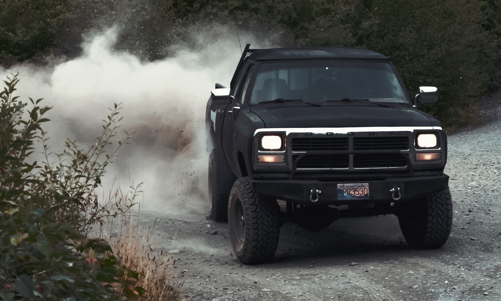 Diesel 4WD kicking up dust on a bush track